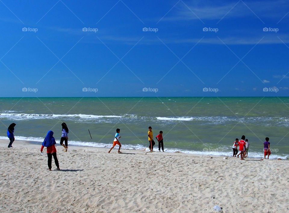 Kids playing on the beach