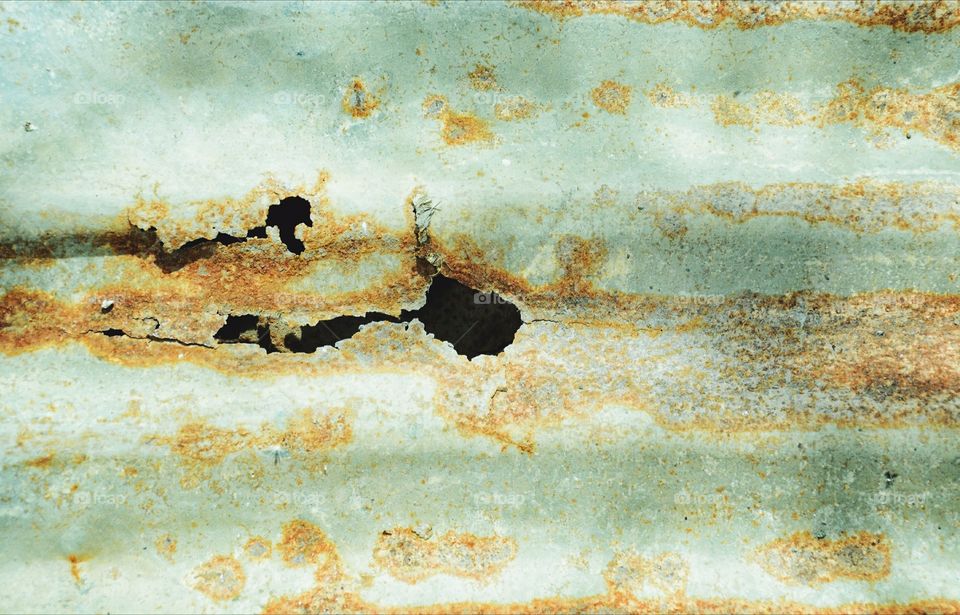 Pattern of rust on decaying zinc sheet