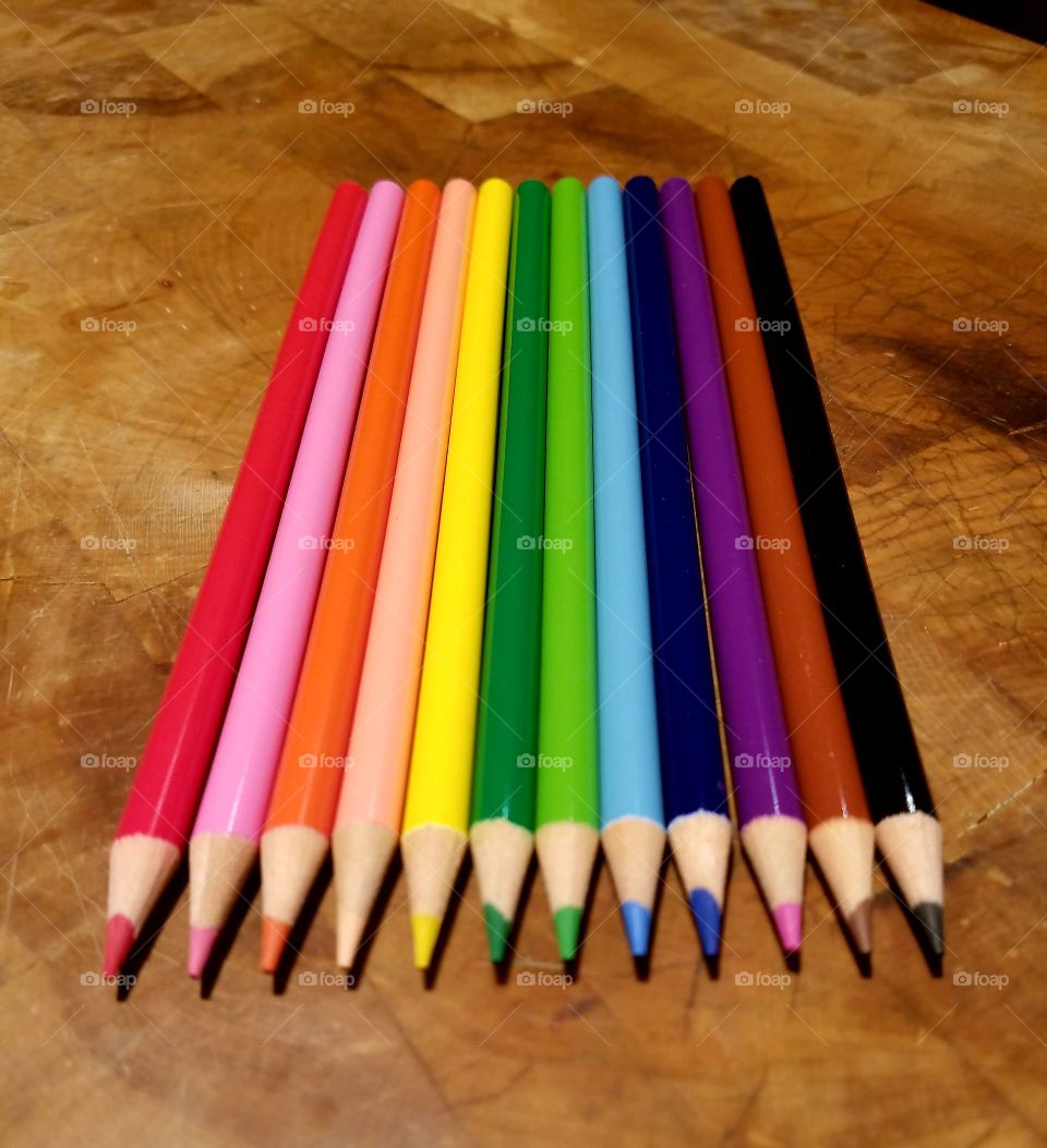Wooden colored pencils in rainbow of colors.