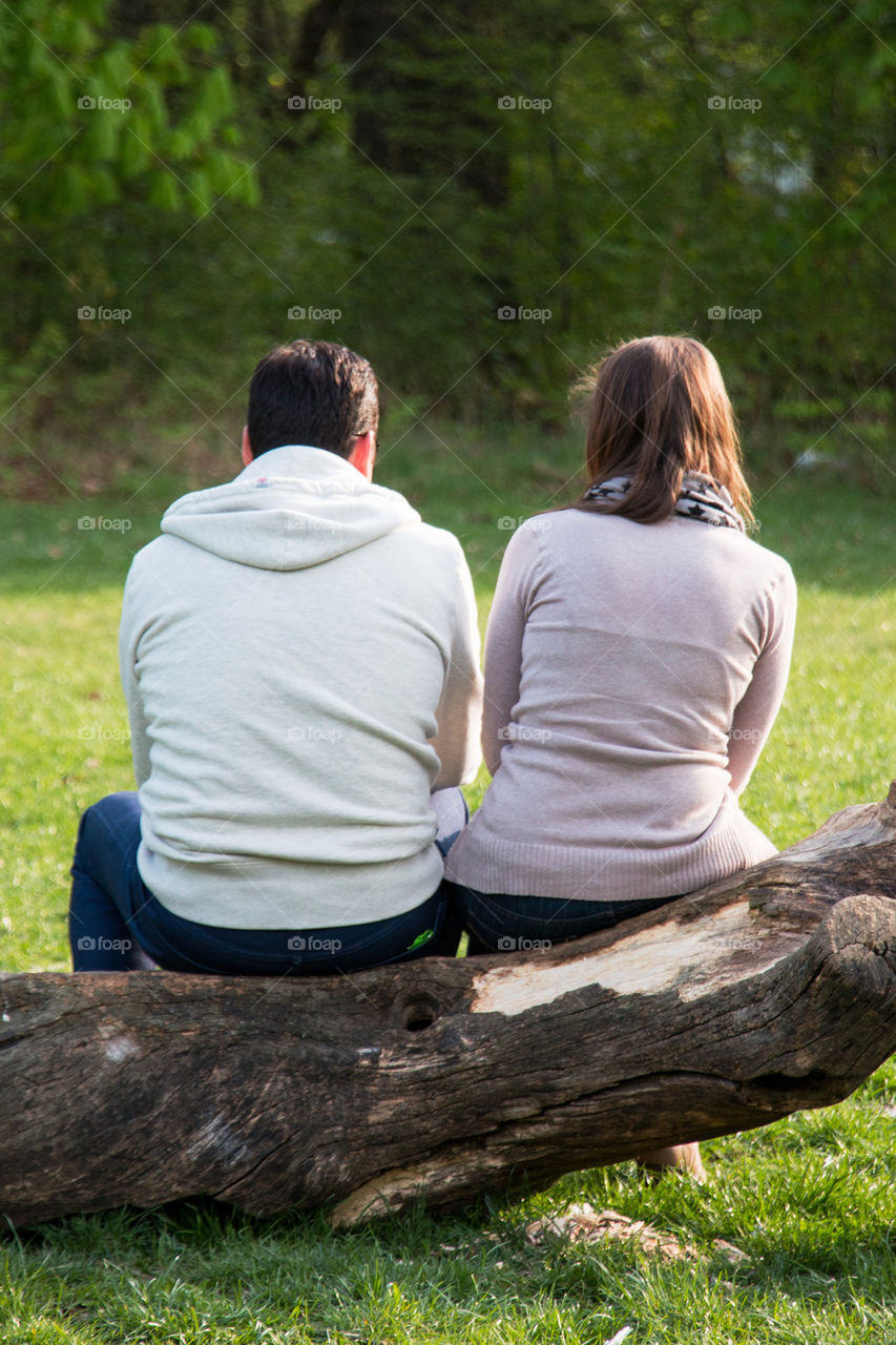 Couple sitting on a log