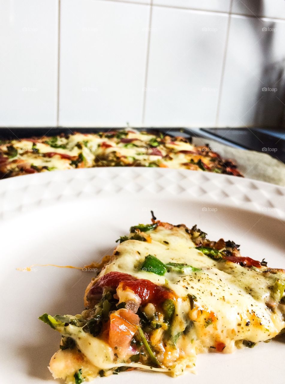 Tabouli Pizza on an organic passata sauce-base, topped with mozzarella cheese & cherry boccocini, fresh cut green chilli, red chilli flakes, oregano & rosemary.