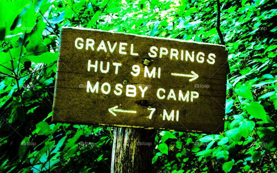 Sign on the Appalachian Trail pointing to the next shelters.