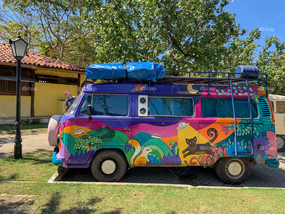 Pop of colors . Minivan Volkswagen parking in the street 