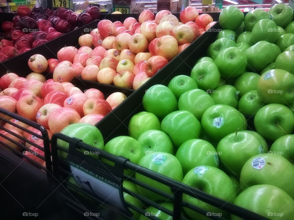 Variety of apples in market stall