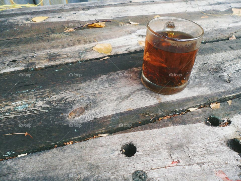 A cup of tea on an old table