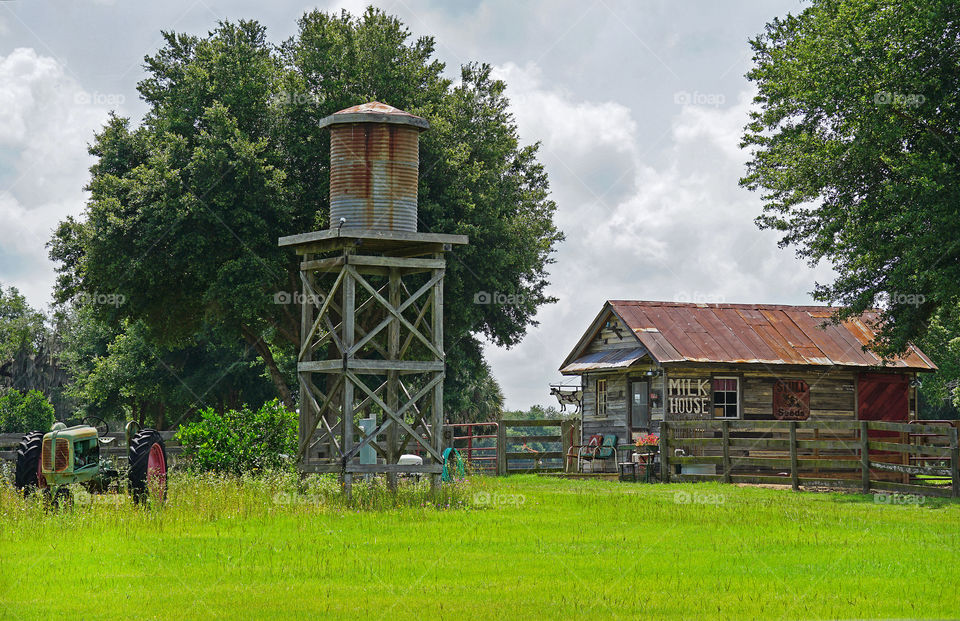 Milk house and tractor in the countryside 