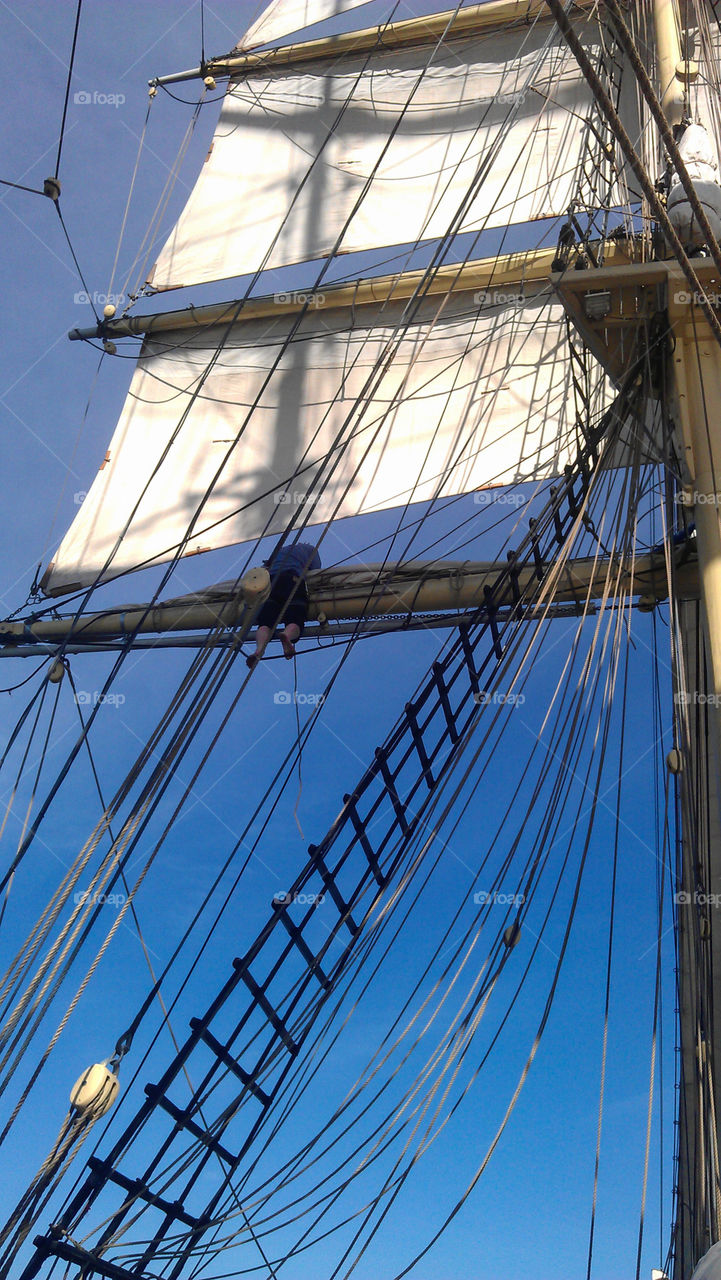 Sail against a blue sky, old sailboat