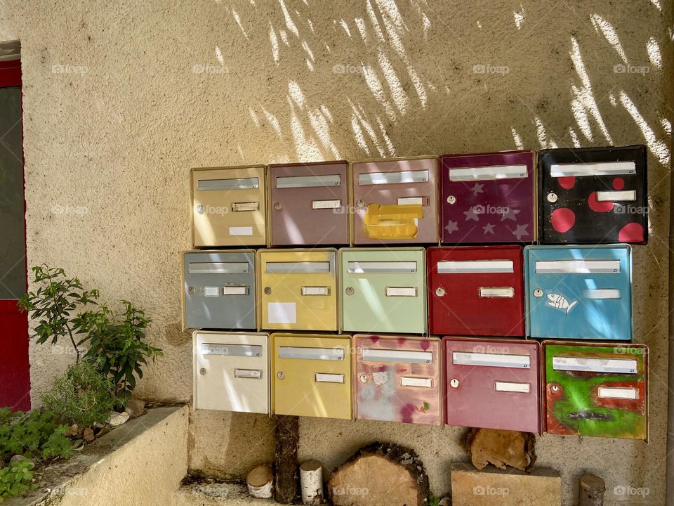 Rows of colourful mailboxes 