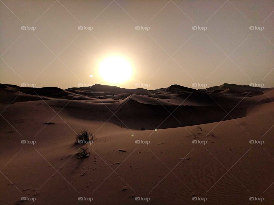 Sunset (Sunrise) at Dusk (Dawn) over the Sand Dunes of the Sahara Desert in Morocco