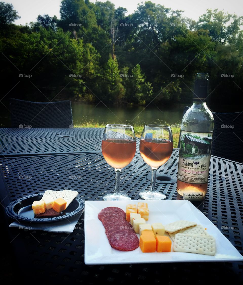 Wine and cheese by the lake