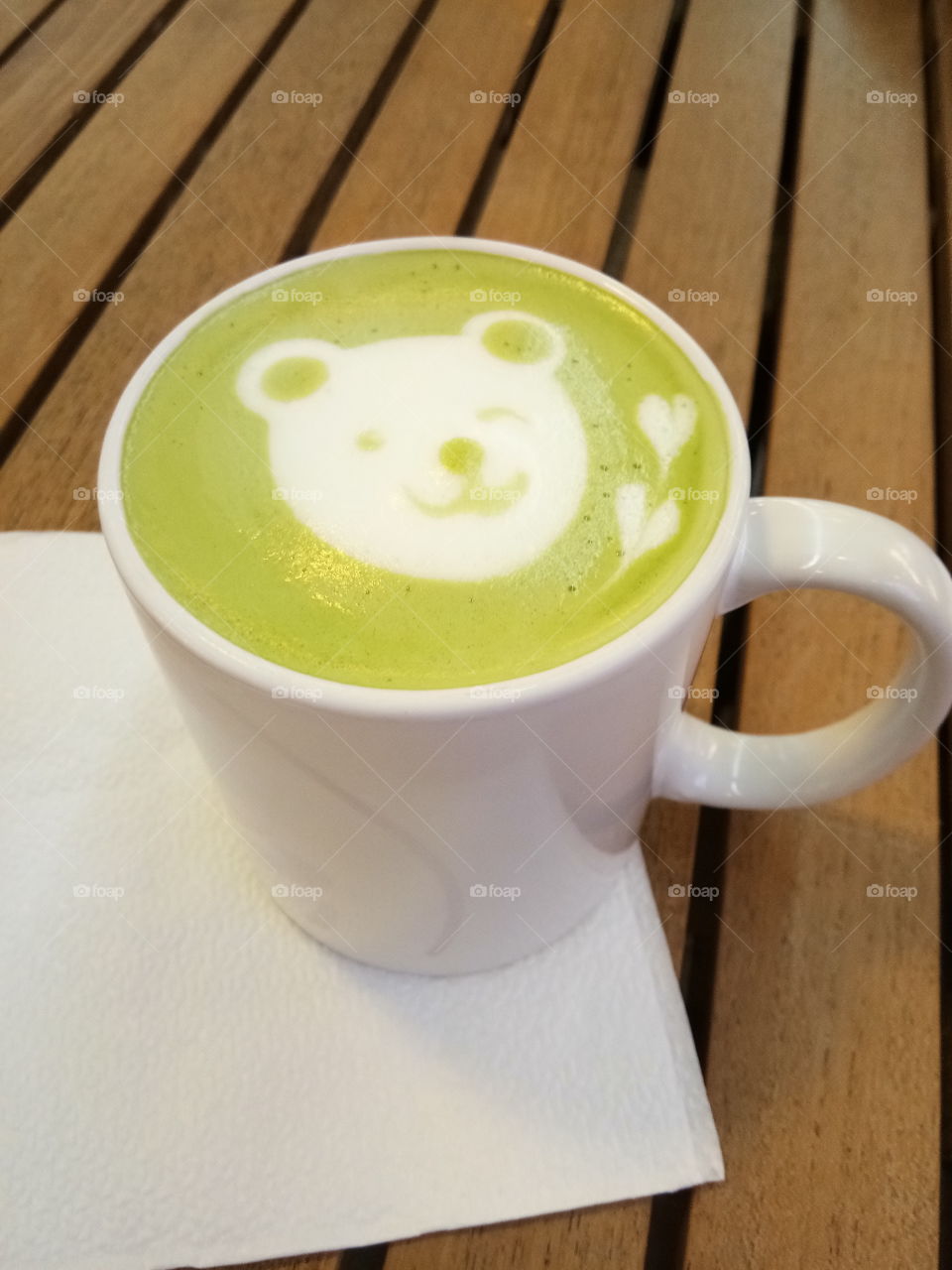 A sip of green tea with bear