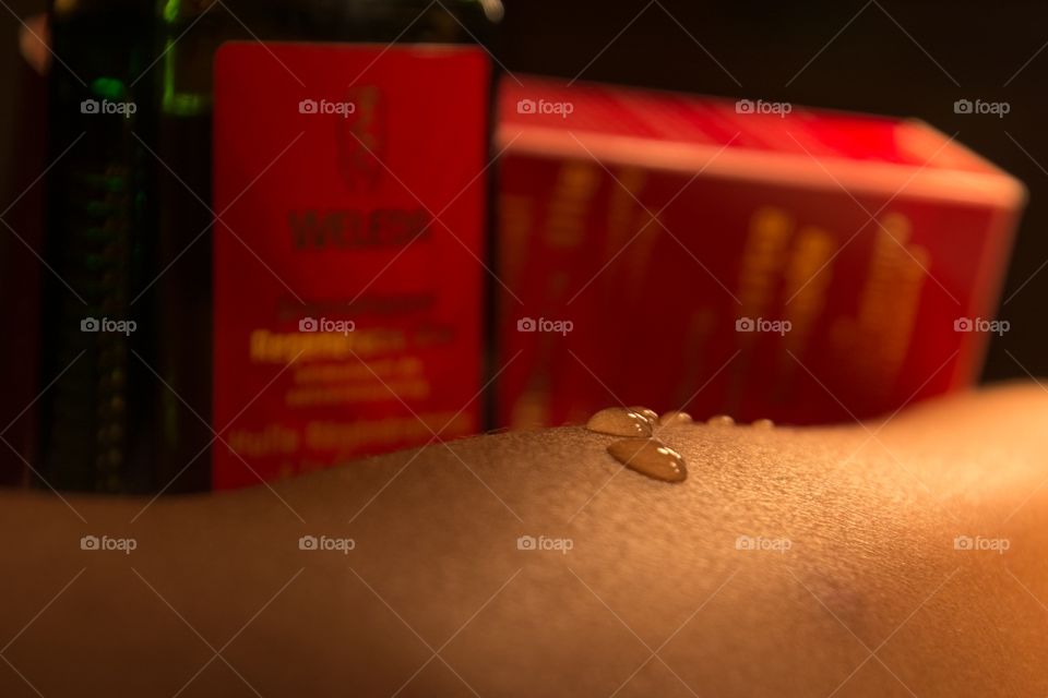 Drops of weleda oil on a arm
