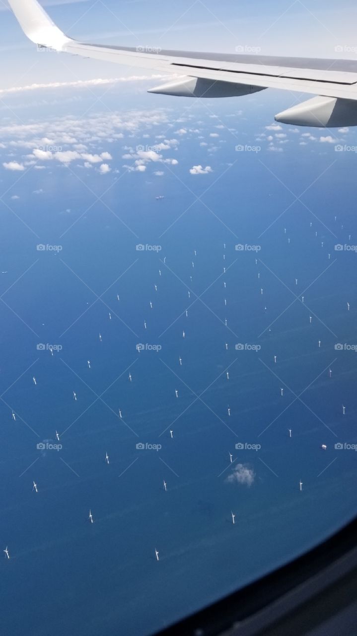 A sea of windmills in the Irish sea captured flying over to the United Kingdom