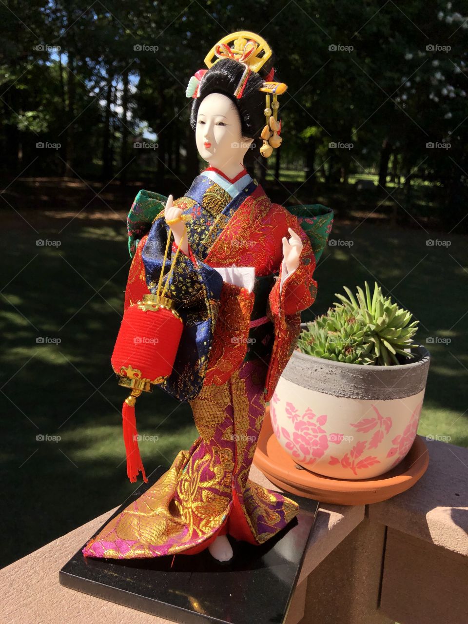 A precious Christmas gift from my mother due to my love of the movie “Memoirs of a Geisha”.  A beautiful Geisha doll in a fashionable colorful silk kimono.  No editing just good photography.