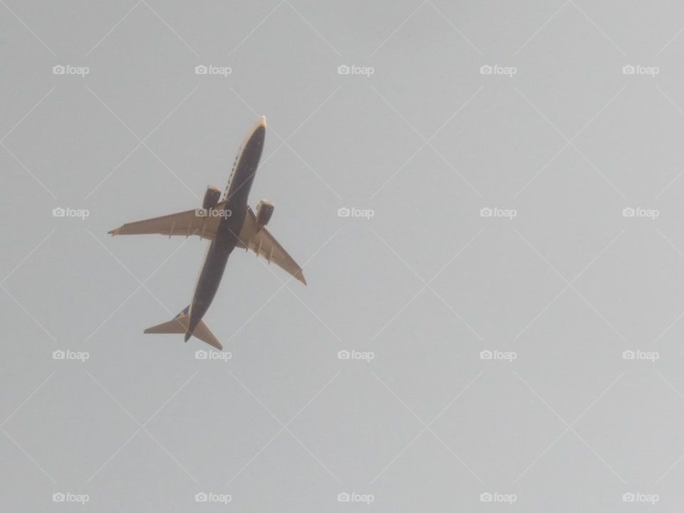 Beautiful airplane flying cross the sky at marrakech city in Morocco.