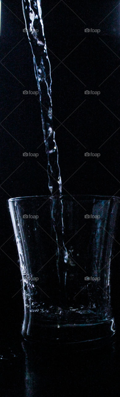 Water cascading into a cup 