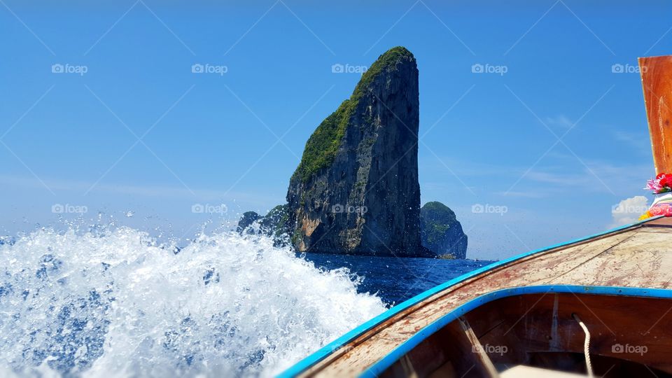 Exploring Phi Phi Thailand on a long tail boat. Breathtaking scenery.