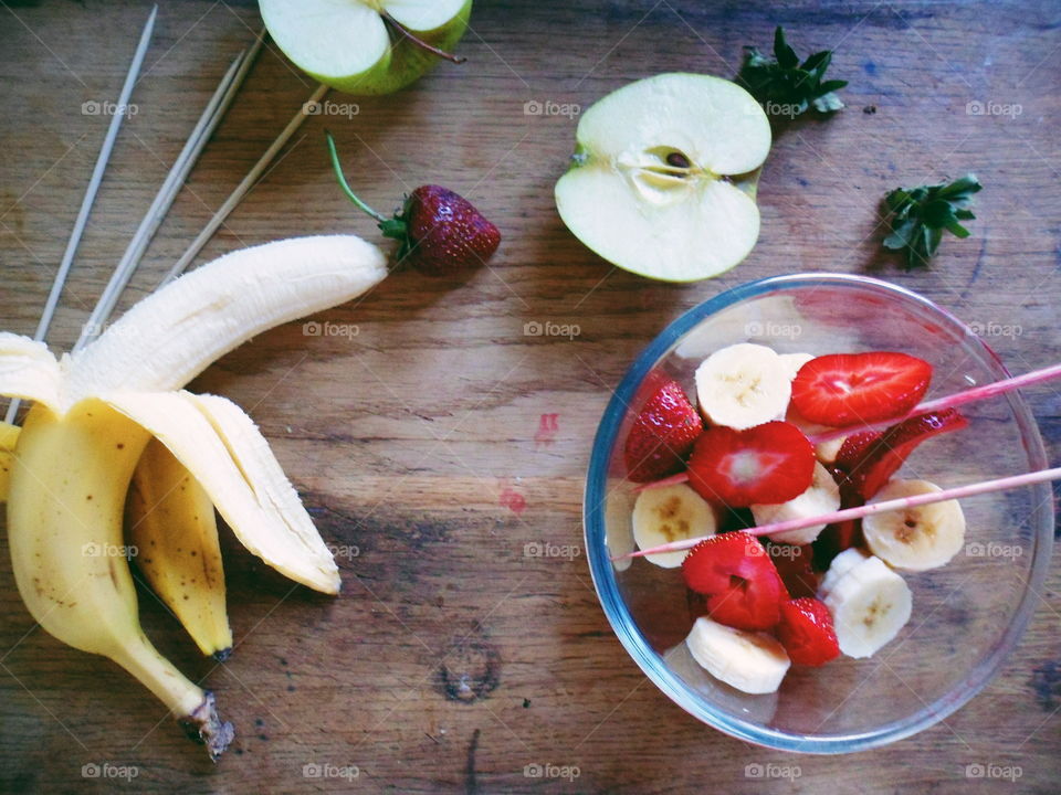 Fruit salad in bowl on table