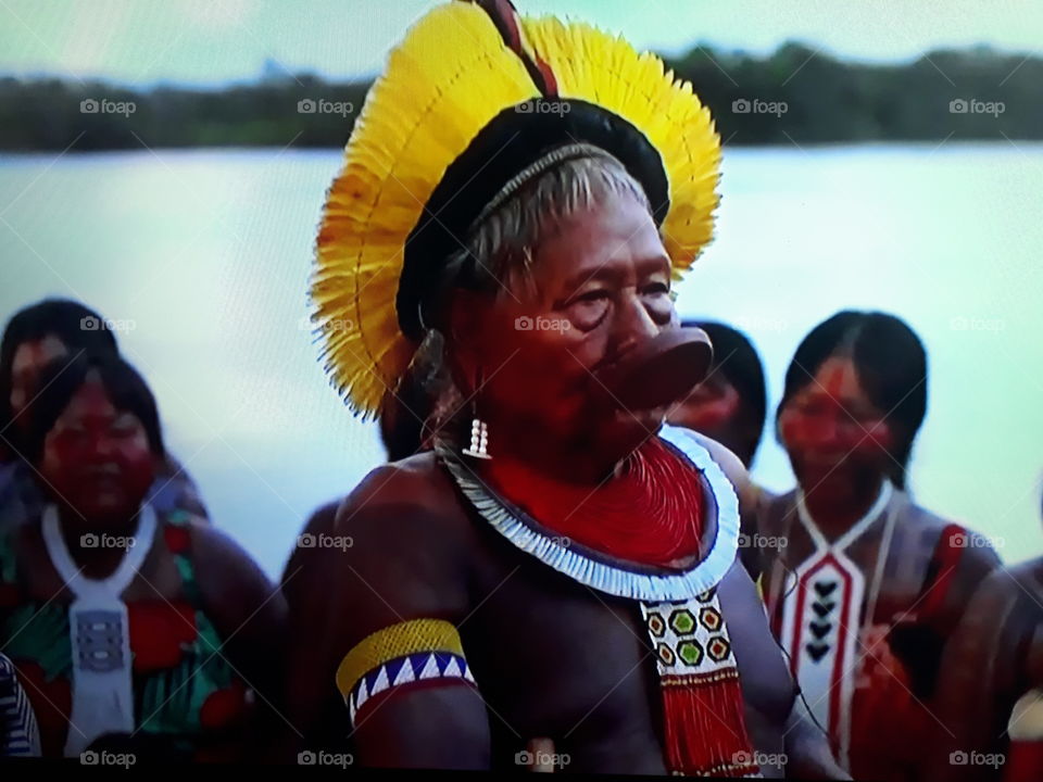 indigenous village in the Brazilian Amazon with its Chief giving order to its Indians