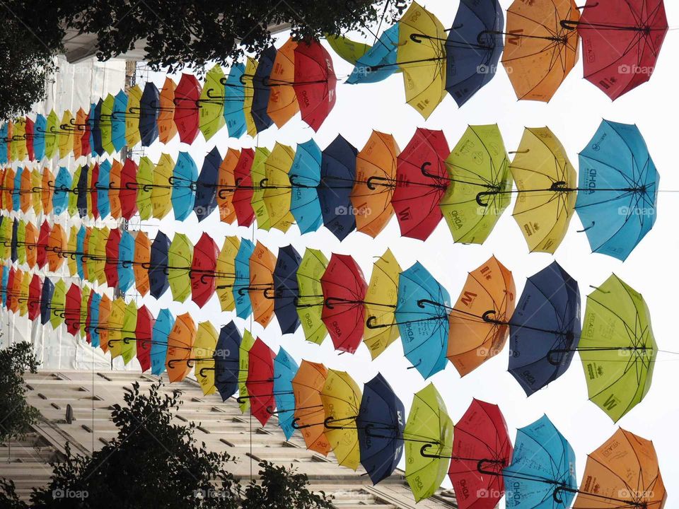 Colorful Umbrellas on top of a street in Liverpool.