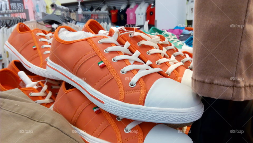 Different size shoes being sold in the market