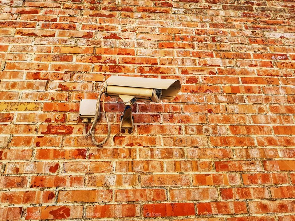 Video surveillance camera in a brick wall