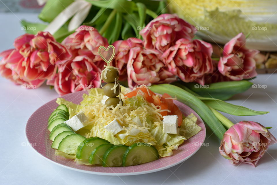 Greek salad with tulip flowers