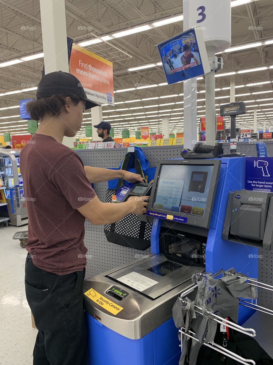 Using self check out at the store 