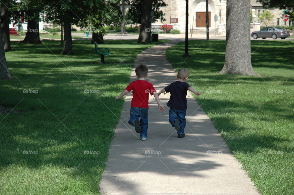 Running. Brothers running through the City Park