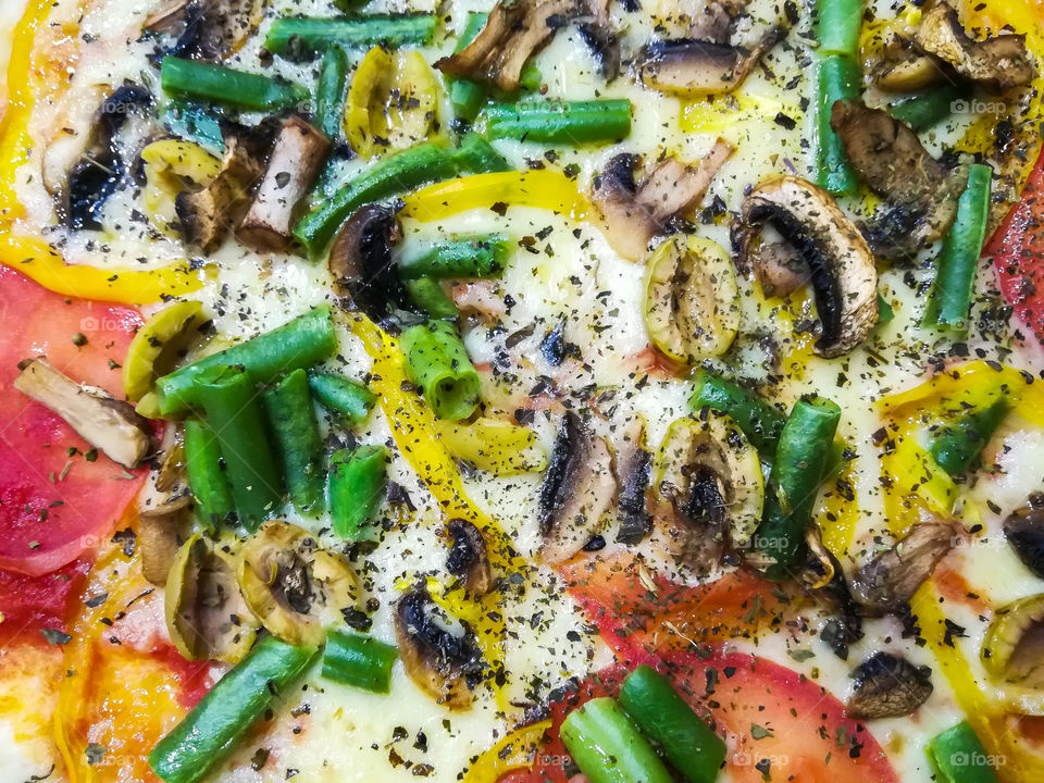 background, close-up of the tasty vegetarian pizza; vegetables, no meat