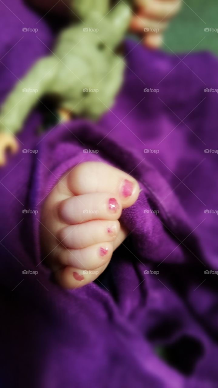 Baby toes..This is so cute because she has painted toe nails an army man