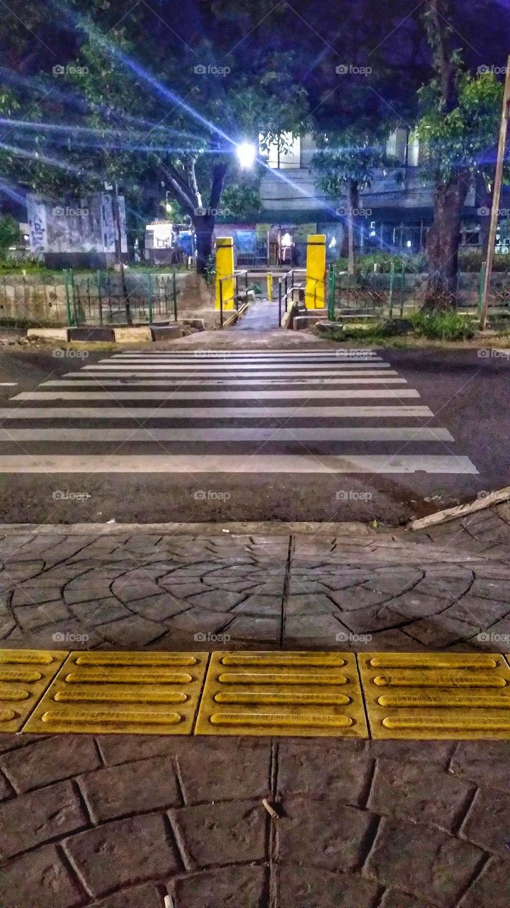 The pedestrian lane crosses the road intended for pedestrians who will cross the road
