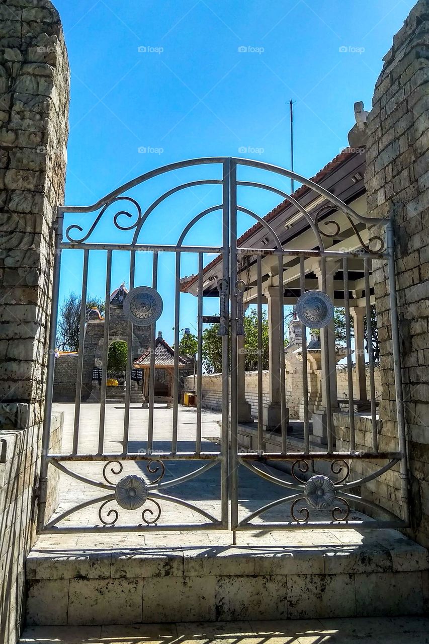 Temple covered by a fence in eye level view