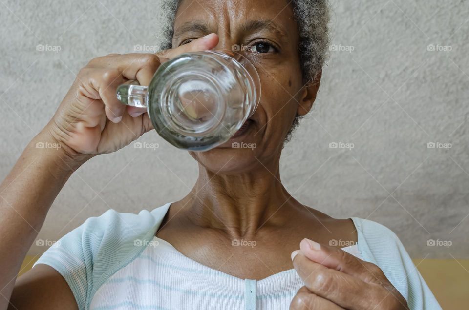 Woman Drinking From A Glass Cup