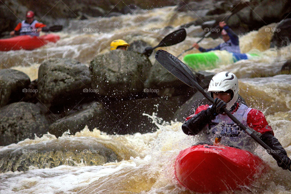 Helsinki, Finland -  April 17, 2016: Unidentified racer at the annual iceBREAK whitewater kayaking competition at the Vanhankaupunginkoski rapids in Helsinki, Finland. 