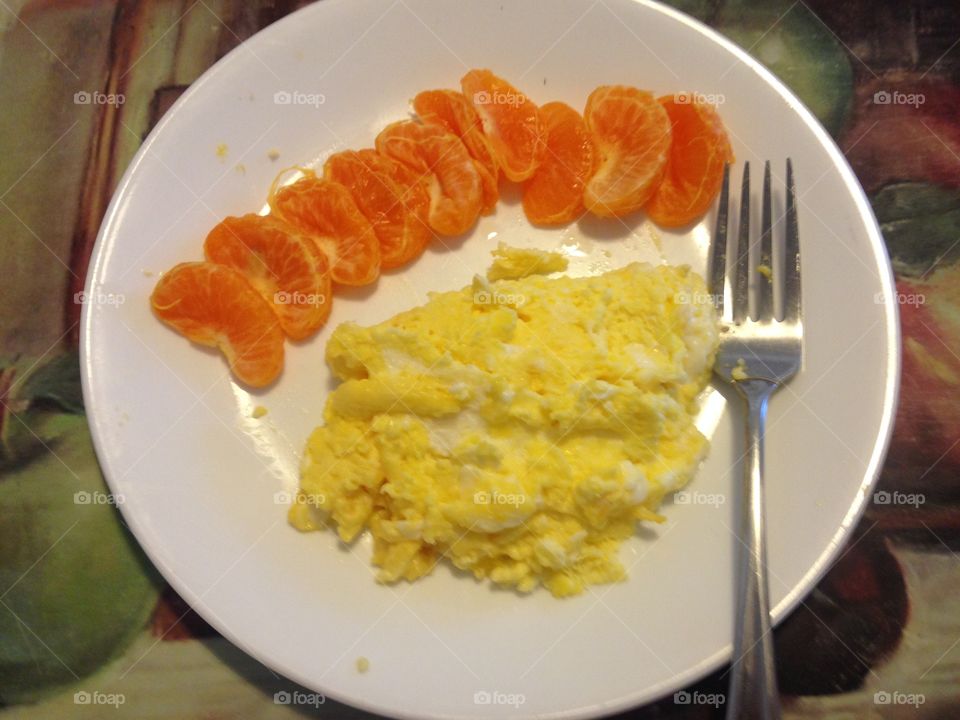 Scrambled eggs and oranges by a 10 year old