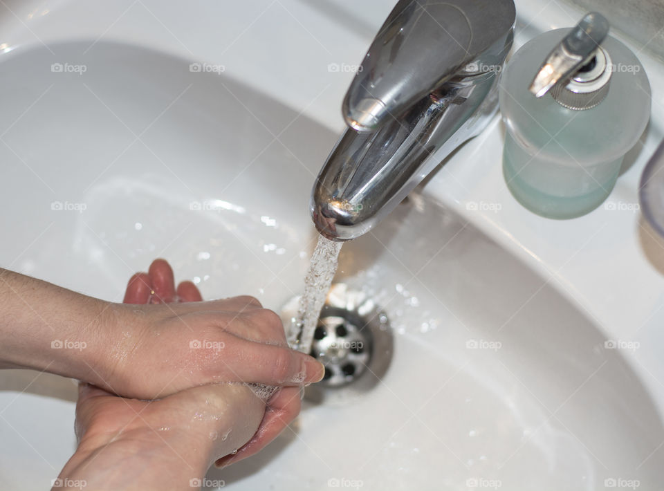 Woman is washing her hands