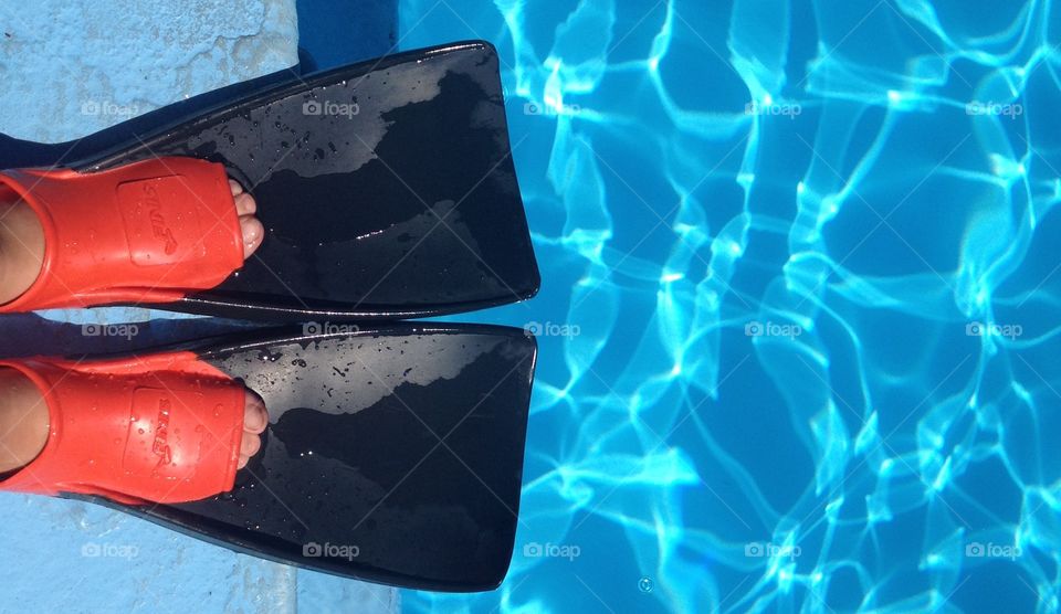 Getting ready to jump in the water wearing fins
