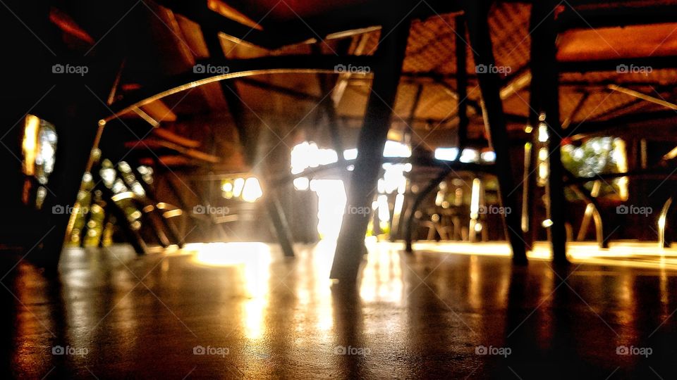 underneath the tables and chairs, beautiful sun rays