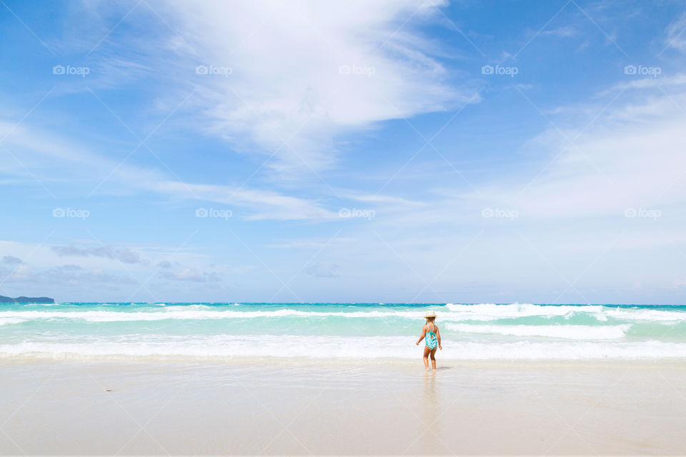 Little girl and big ocean