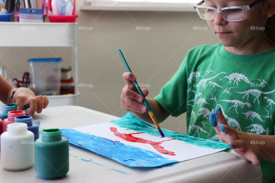 Children creating paintings