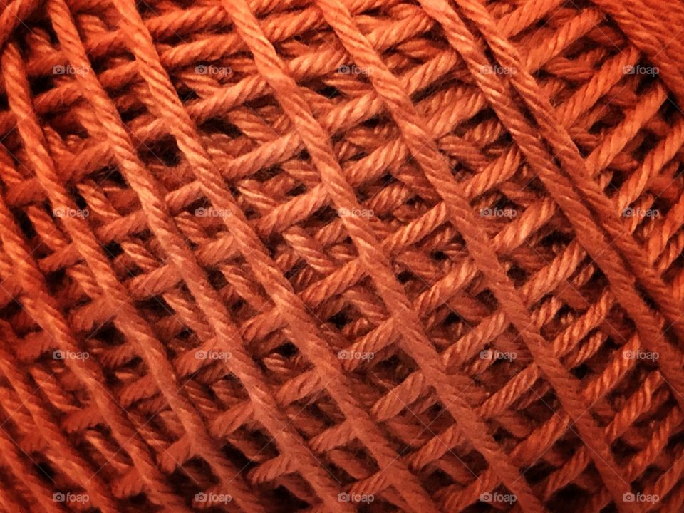 A cotton ball for crochet, in detail, just waiting for someone to transform it in a beautiful masterpiece. The closeup gives us a nice texture to look at while working...