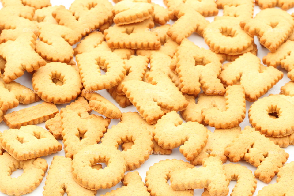 A full frame background image of alphabet shaped cookies 