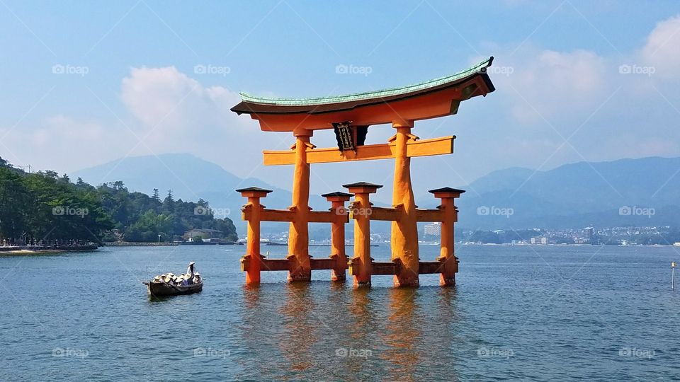 Floating torii gates and long-tail boat