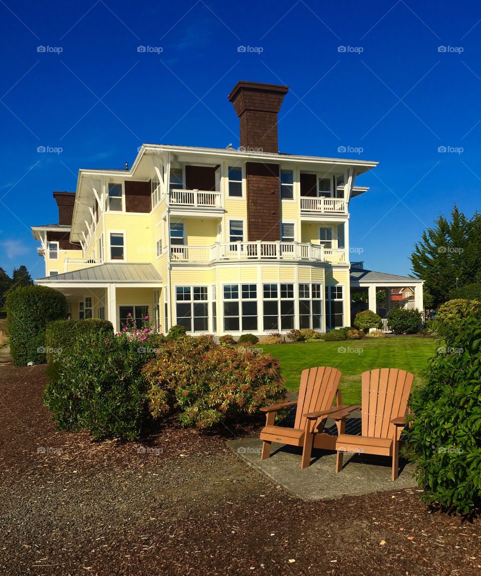Luxury house with lawn and chairs
