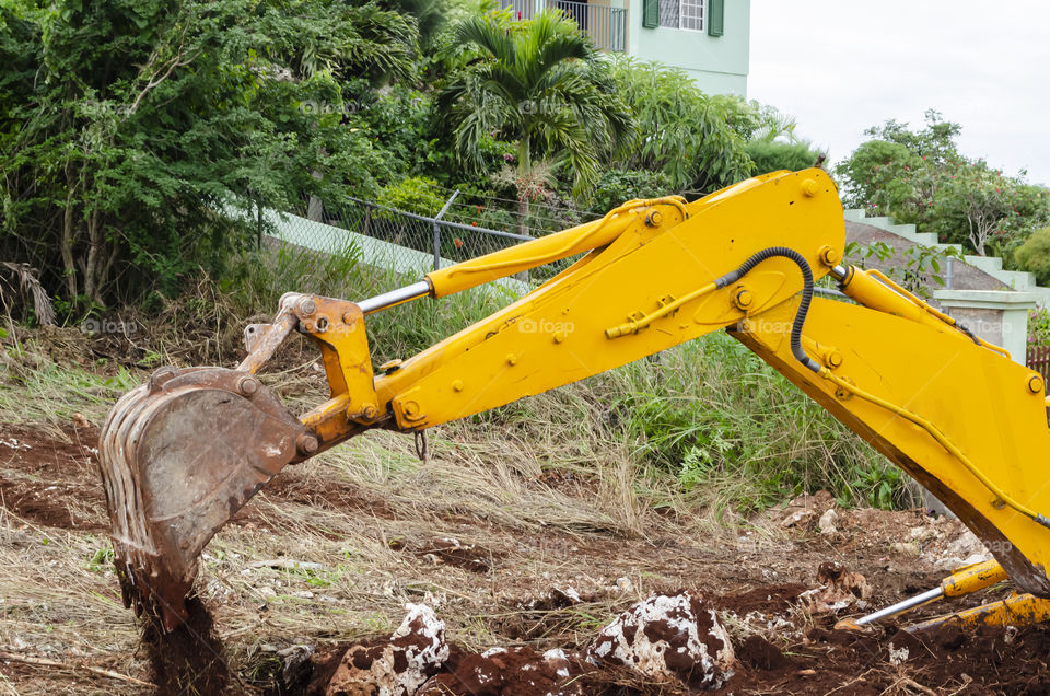 Backhoe Pouring Out Dirt