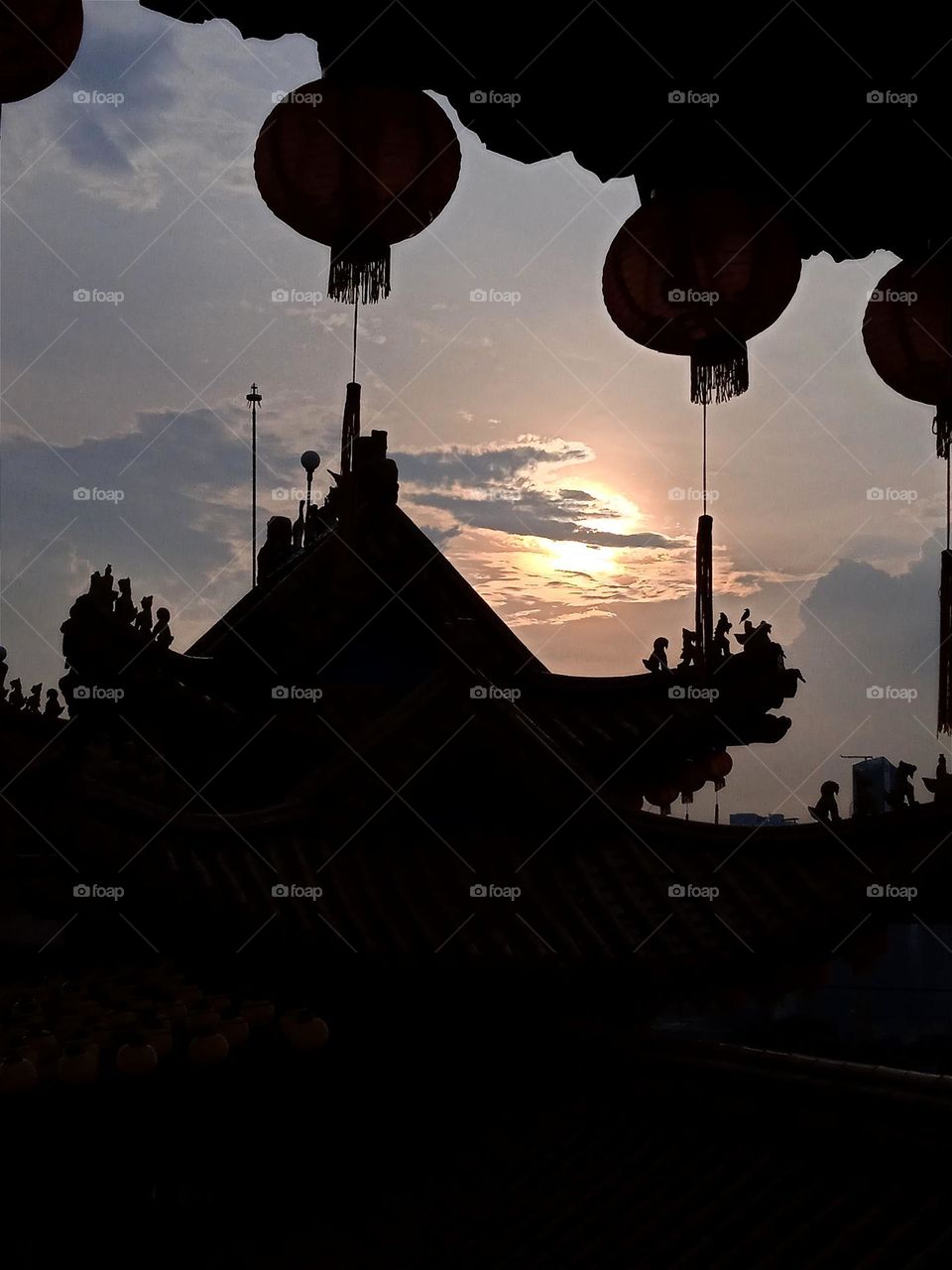 The sunset with the temple's silhouettes.