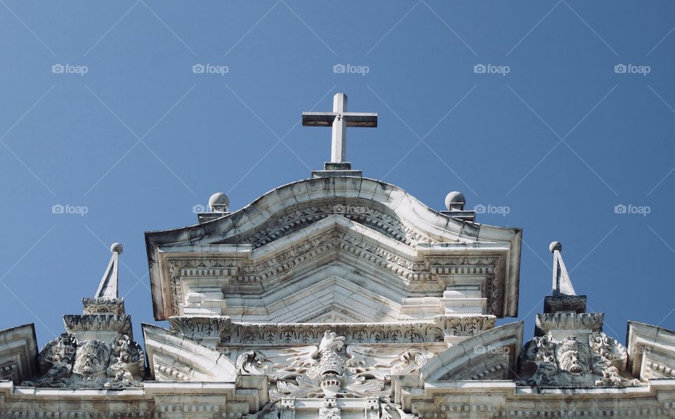 Looking up at on old church in Coimbra , Portugal 