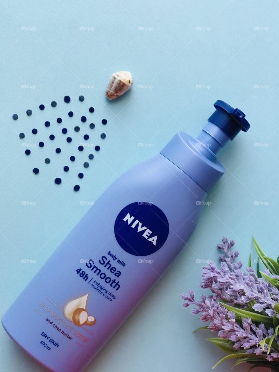 Nivea brand and shell rain drops and lavender flowers.