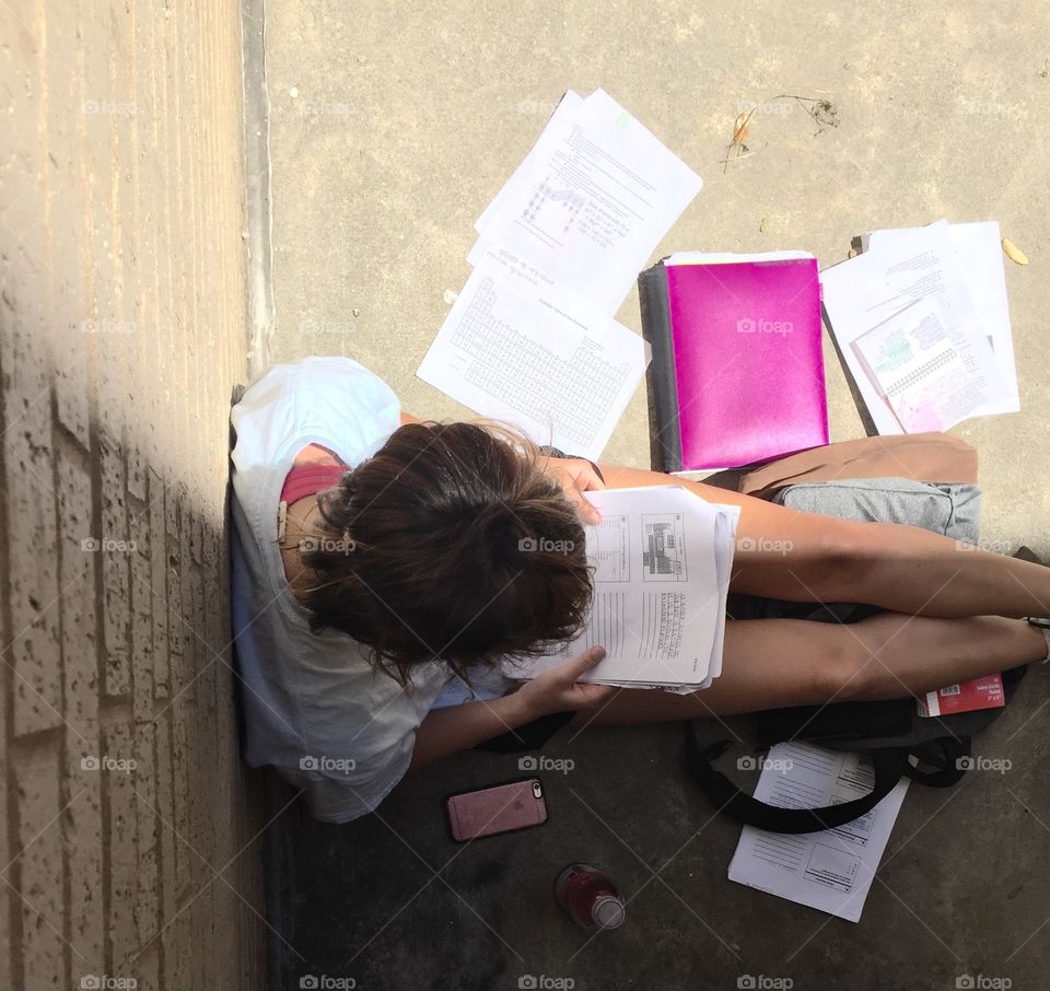 Student studying outside.